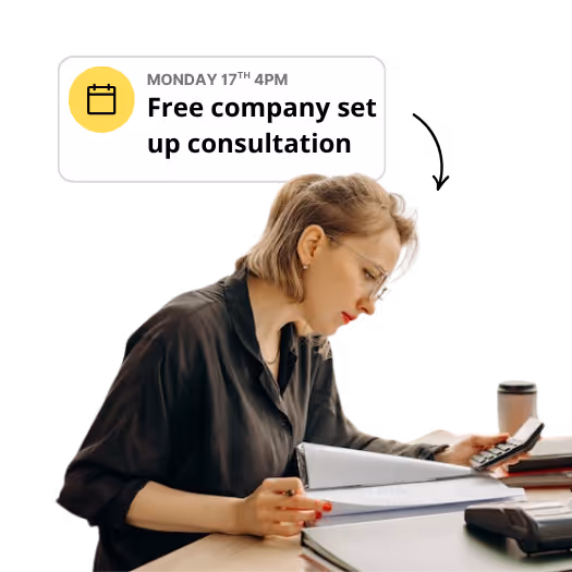 Freelancer using a calculator with a free company set up consultation icon above them
